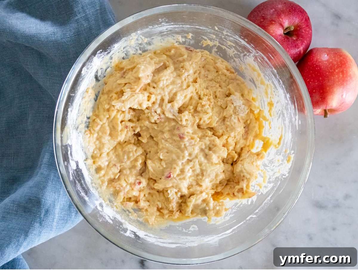 Protein Packed Cinnamon Apple Muffins 7 Step 3 Dry ingredients folded gently into apple muffin mixture.