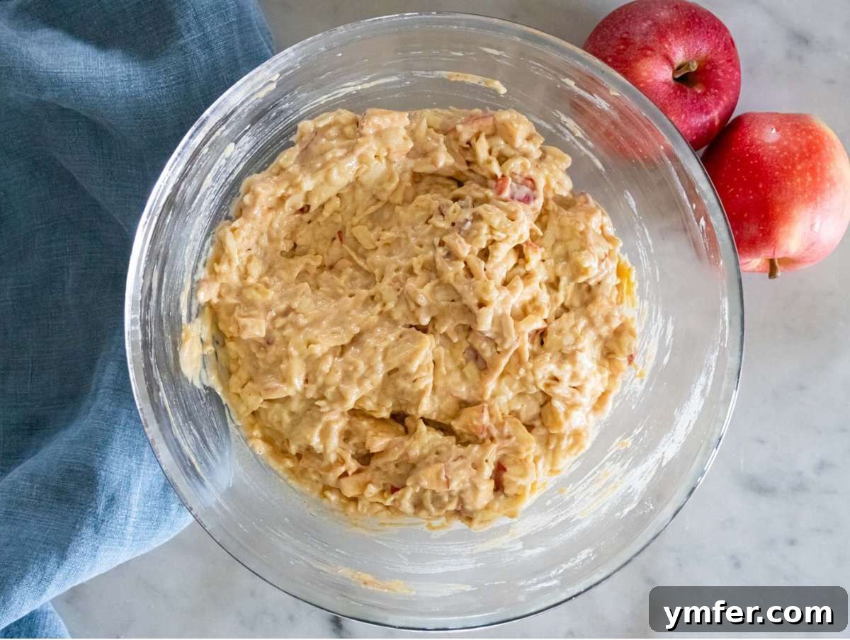 Protein Packed Cinnamon Apple Muffins 8 Step 4 cinnamon sugar diced apples folded into muffin batter.