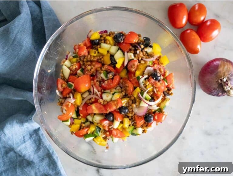 Greek Lentil Salad with a Zesty Marinade Dressing 13 Step 3 Chopped cucumber tomatoes onion olives and bell pepper mixed with marinated lentils.