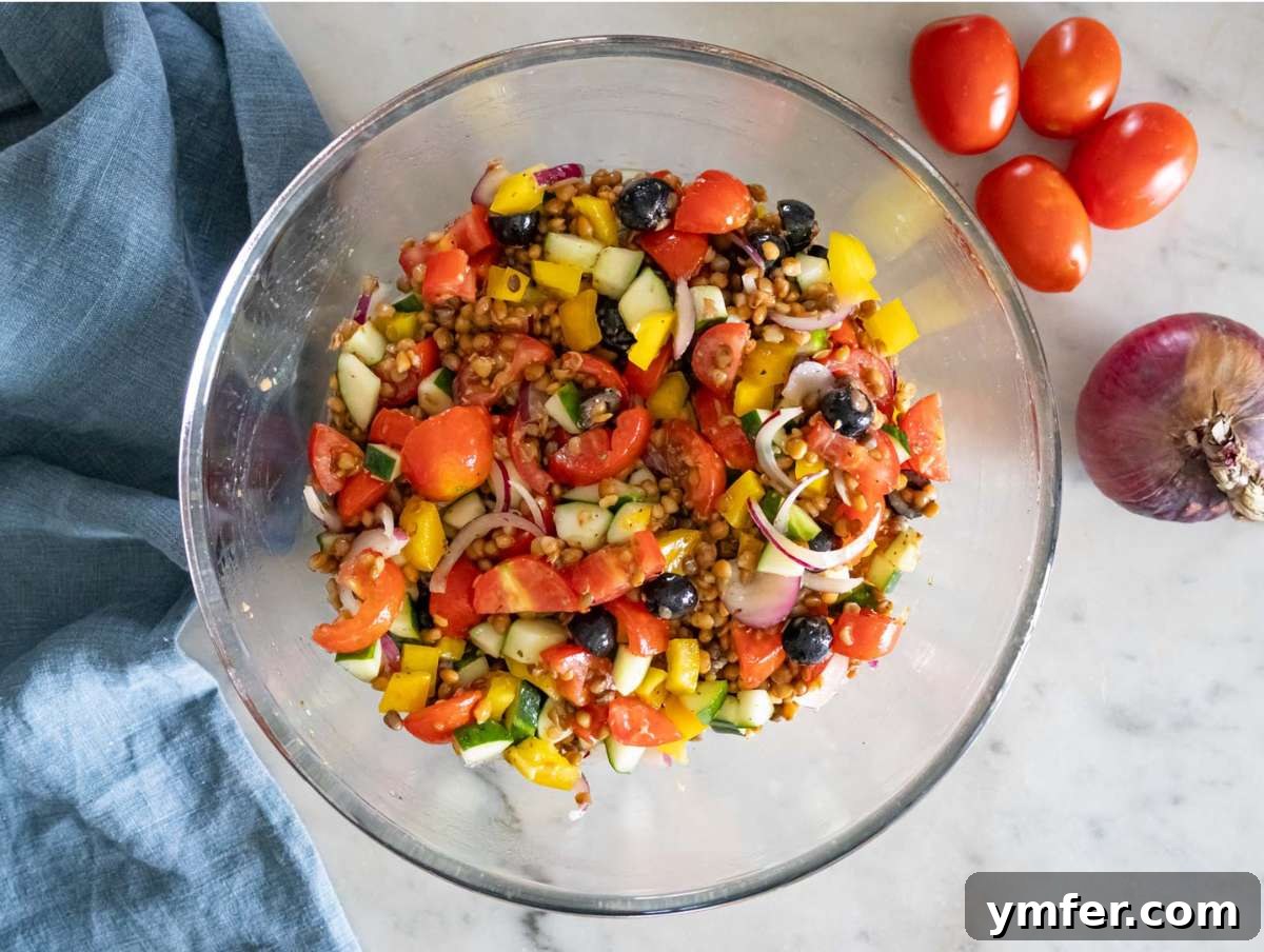 Greek Lentil Salad with a Zesty Marinade Dressing 7 Step 3 Chopped cucumber tomatoes onion olives and bell pepper mixed with marinated lentils.