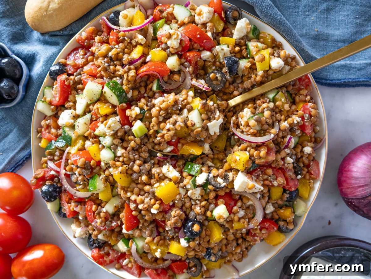 Greek Lentil Salad with a Zesty Marinade Dressing 8 Step 4 Greek lentil salad with feta crumbled in served on a large platter.