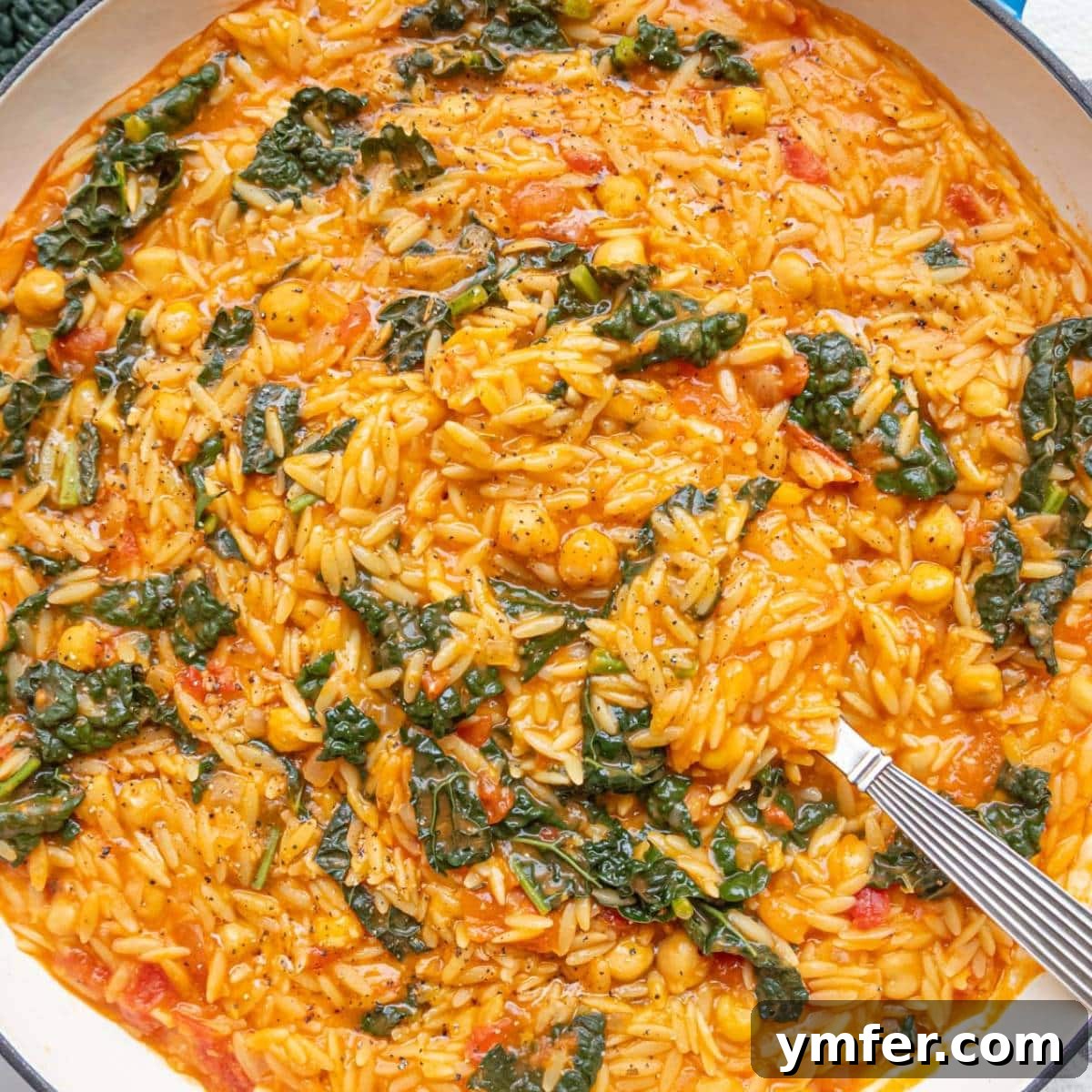 Boost Your Gut: 25+ Fiber-Packed Meals for Digestive Health 17 Warm Tuscan Orzo with Chickpeas and Kale in a rustic cast-iron skillet.