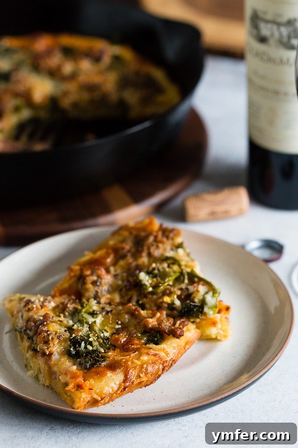 Individual slices of Sausage Broccoli Rabe Skillet Pizza on a plate, ready to be enjoyed, showing the appealing texture and topping distribution.