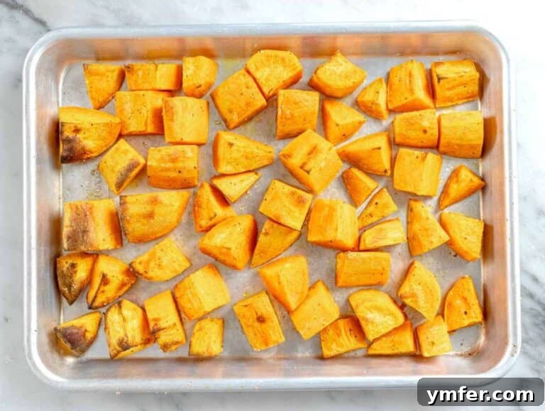 Step 1 Cubed sweet potatoes on baking tray roasted for Mediterranean lentil salad.