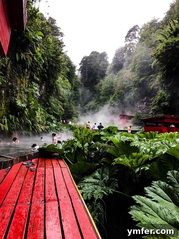 Termas Geometricas Pucon Chile Your Geothermal Escape 7 A traveler enjoying the warm, mineral-rich waters of Termas Geometricas on a cool day.