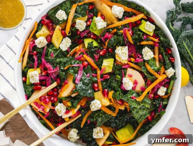 Mediterranean Kale Power Salad: Healthy and Fiber-Packed 12 Step 4 Tossing Mediterranean kale salad with feta apple avocado and homemade dressing before serving.