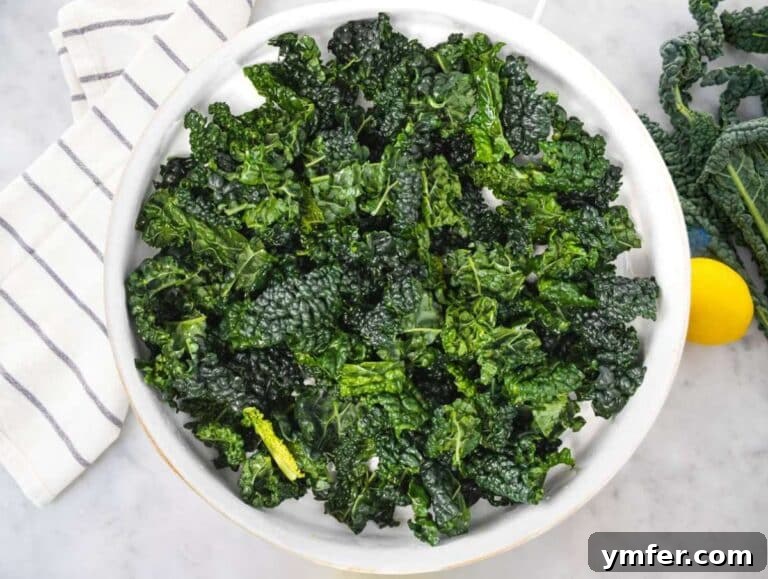 Mediterranean Kale Power Salad: Healthy and Fiber-Packed 9 Step 1 Massaged kale leaves with lemon and salt in large mixing bowl.