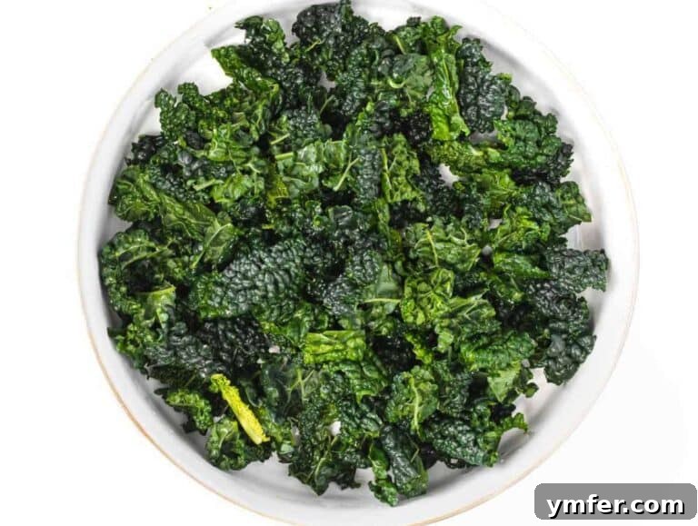Nourishing Butternut Squash Kale Salad 11 Step 2 Kale leaves chopped and massaged with lemon juice and salt in a large bowl.