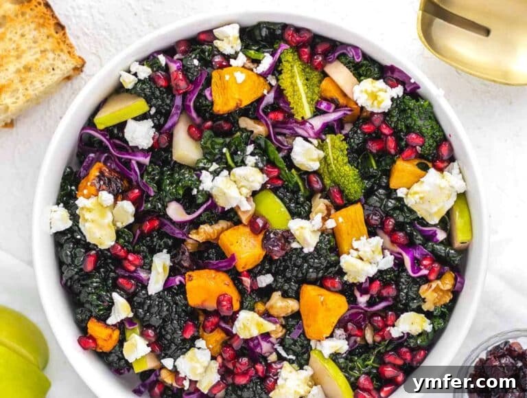 Nourishing Butternut Squash Kale Salad 13 Step 4 Colorful salad bowl with kale roasted squash apple walnuts feta and pomegranate tossed with dressing.