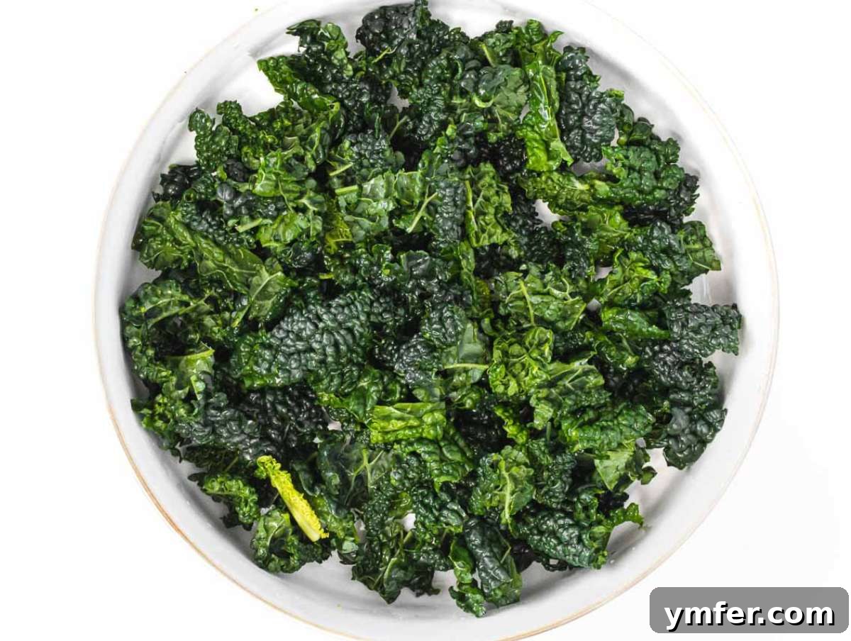 Nourishing Butternut Squash Kale Salad 6 Step 2 Kale leaves chopped and massaged with lemon juice and salt in a large bowl.