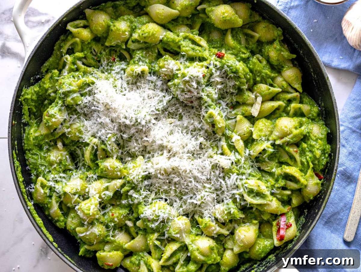 Step 3 Pasta tossed in creamy smashed broccoli sauce with parmesan and pasta water in skillet.