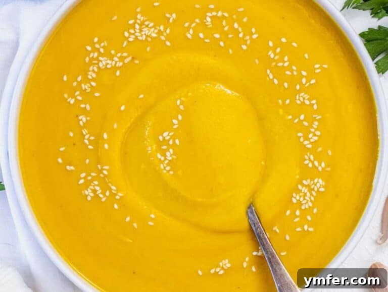 Nourishing Creamy Coconut Pumpkin Soup for Fall 15 Step 5 Coconut pumpkin soup served in bowls with fresh lime juice squeezed on top.