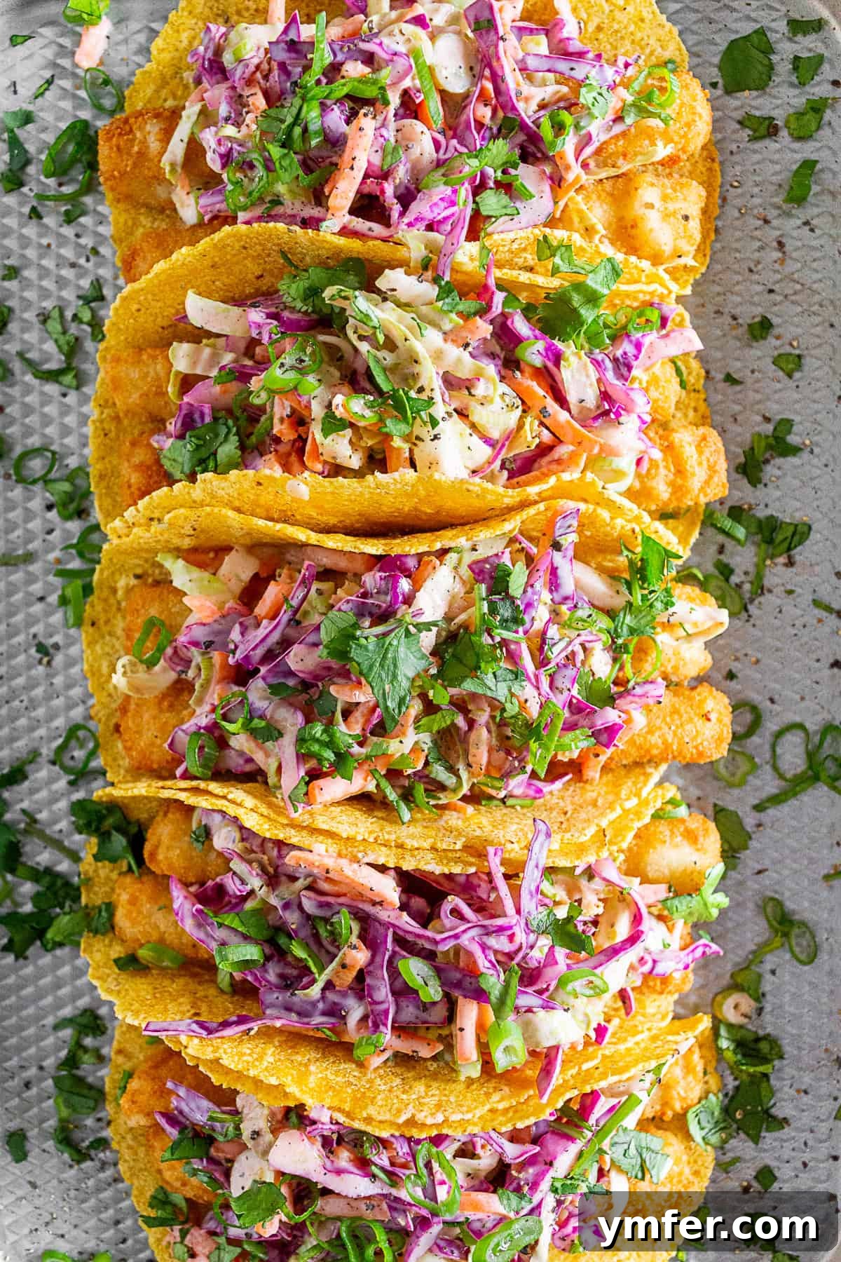 No-Fuss Fish Tacos 4 Fish stick tacos topped with vibrant slaw, ready to be served.
