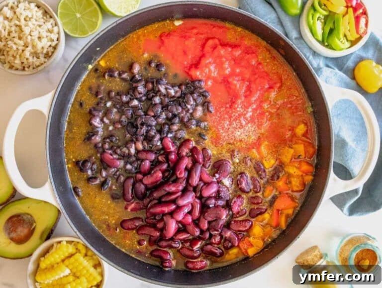 Protein Powerhouse Chili With Beans 11 Step 2 Chili with beans simmering in a pot with tomatoes beans and broth.