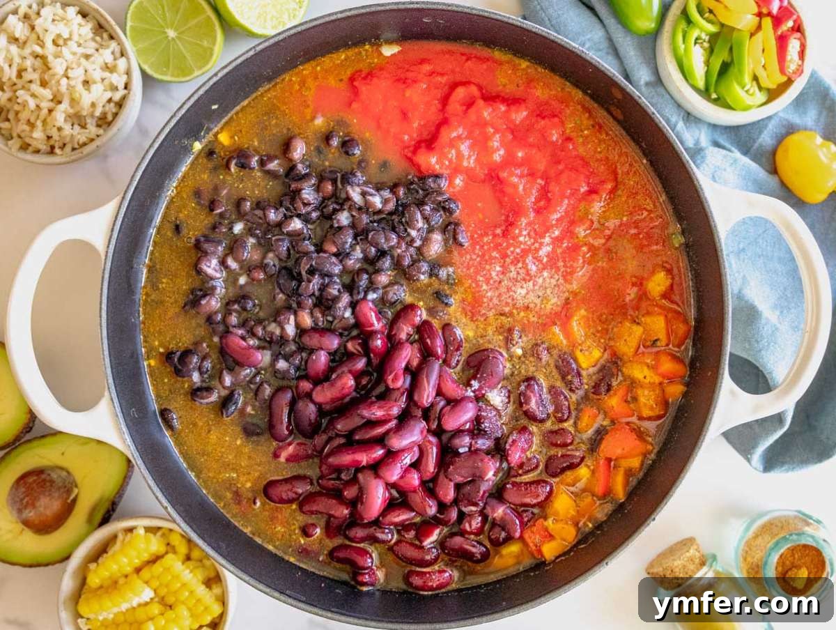 Protein Powerhouse Chili With Beans 6 Step 2 Chili with beans simmering in a pot with tomatoes beans and broth.