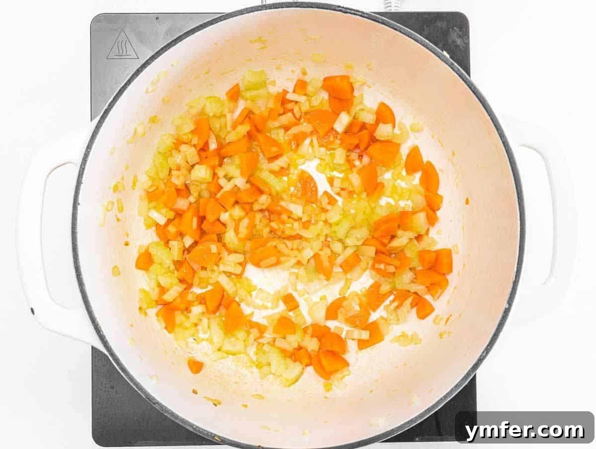 Nourishing Spinach Lentil Soup Easy Dinner 4 Step 1 Sautéing onion, carrot, and celery in olive oil for the soup base, releasing fragrant aromas.