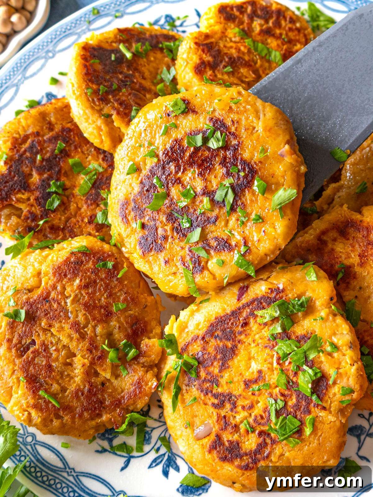 Simple Wholesome Chickpea Sweet Potato Patties 2 Crispy chickpea sweet potato patties with golden crust and tender center, ready to be served.