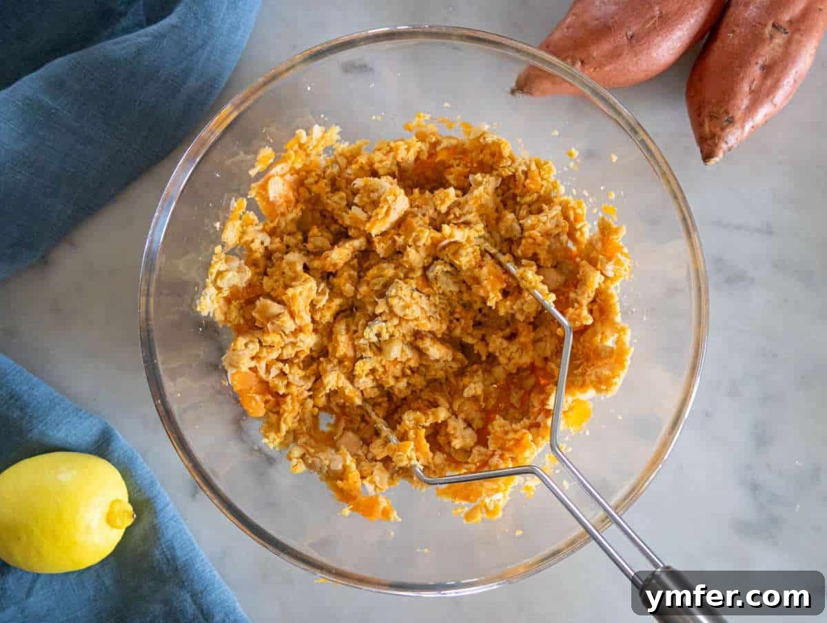 Simple Wholesome Chickpea Sweet Potato Patties 5 Step 1 – A large mixing bowl contains the perfectly mashed chickpea and sweet potato mixture, ready for the next set of ingredients.