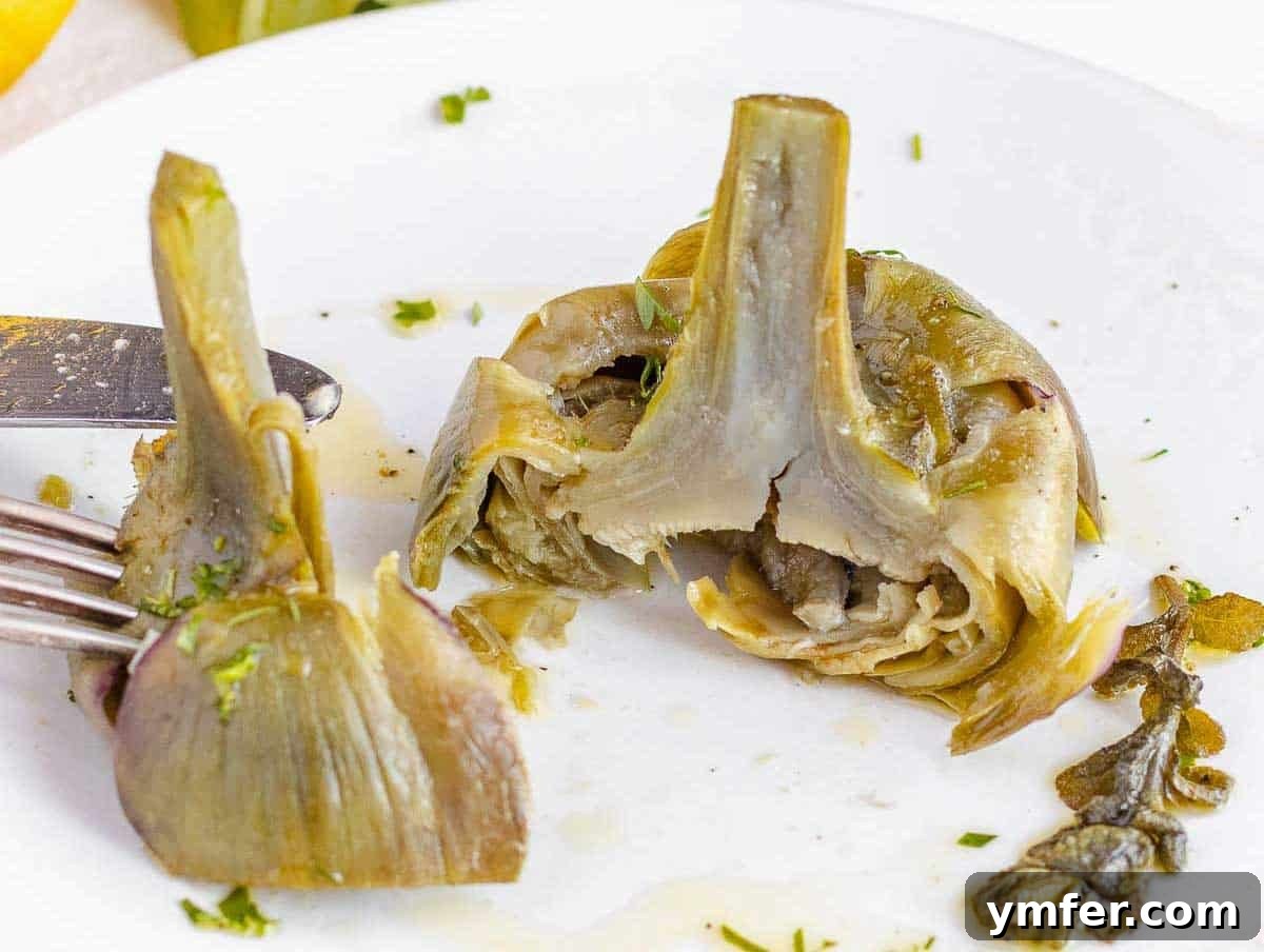 Simple Artichoke Recipes and Cooking Tips 18 cooked artichoke on a plate