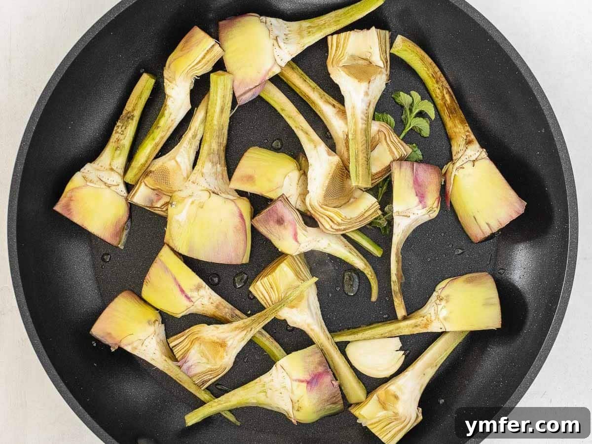 Simple Artichoke Recipes and Cooking Tips 20 artichoke cut in quarter on a pan
