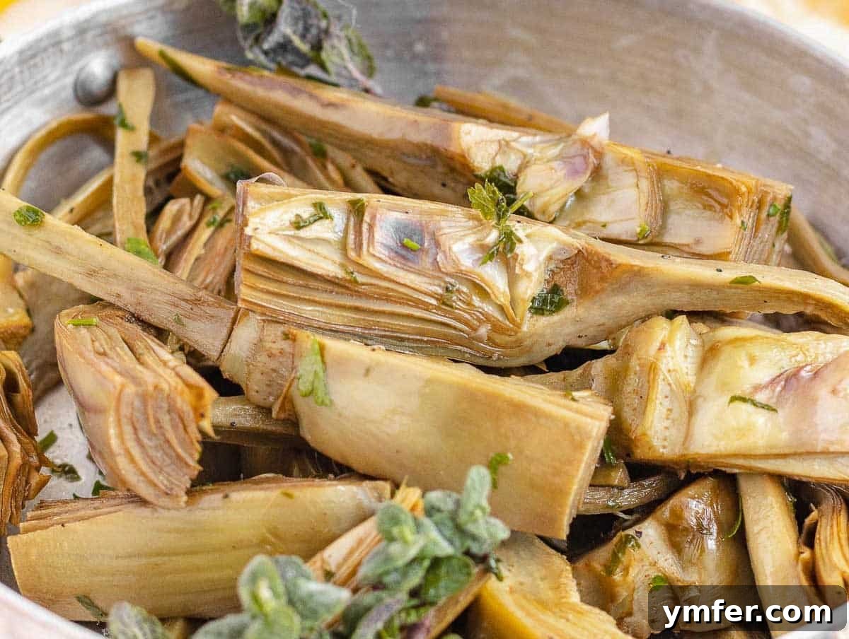 Simple Artichoke Recipes and Cooking Tips 21 artichoke cooked on a pan