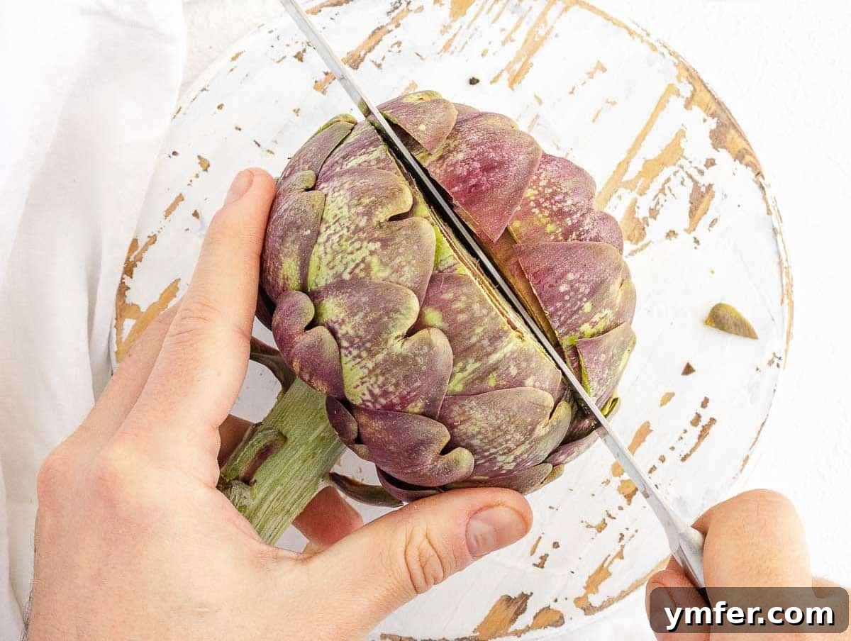 Simple Artichoke Recipes and Cooking Tips 4 cutting off the thorns of an artichoke