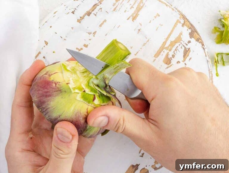 Simple Artichoke Recipes and Cooking Tips 39 peeling stem of artichoke