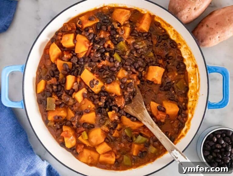 Step 3 image – Simmering the chili until sweet potatoes are tender and flavors combine.