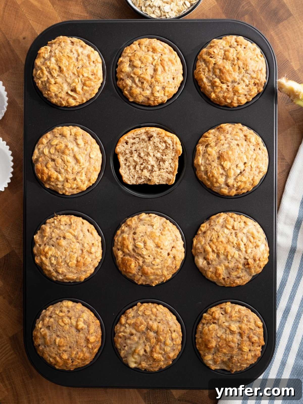 Wholesome Oil-Free Banana Oat Muffins 4 Top down view of banana oatmeal muffins cooling in a muffin pan.
