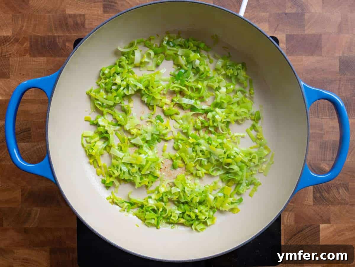 Golden Turmeric Chickpea Rice 5 Step 1 Sautéing leek and garlic in olive oil for the base of turmeric rice with chickpeas.