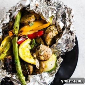Hearty Chicken Sausage and Roasted Veggie Foil Bundles 8 This chicken sausage and vegetable foil packet dinner is super simple to make and perfect for summer. Packed full of chicken sausage, sweet peppers, zucchini, yellow squash, red onion, green beans and drizzled with a herbed olive oil. You'll love this simple dinnertime recipe!