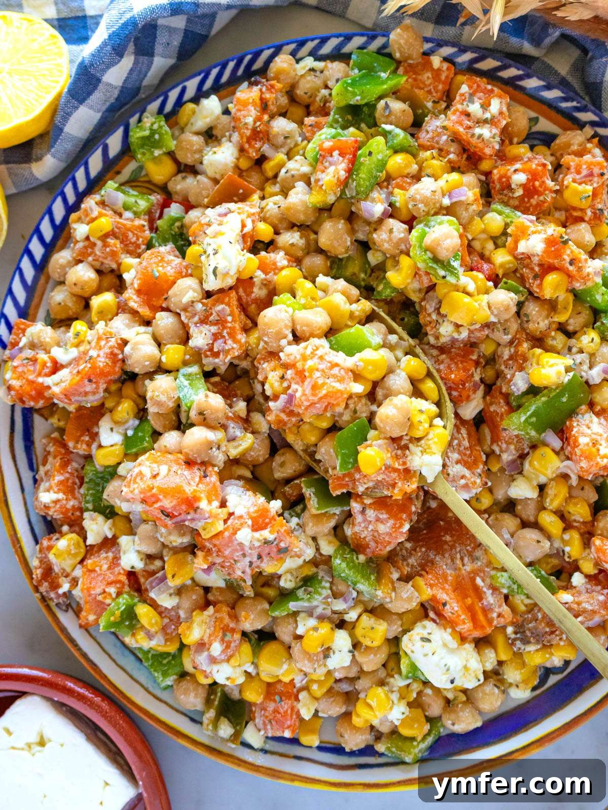 Nourishing Sweet Potato Chickpea Salad 4 Top down view of Mediterranean chickpea sweet potato salad with roasted sweet potatoes, corn, and feta.
