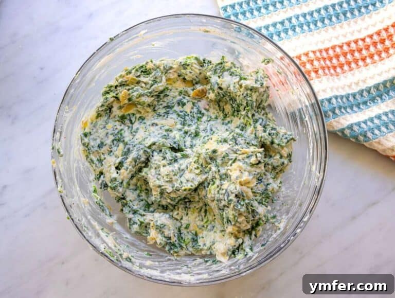 Step two chopped artichokes yogurt ricotta and parmesan stirred into creamy mixture.
