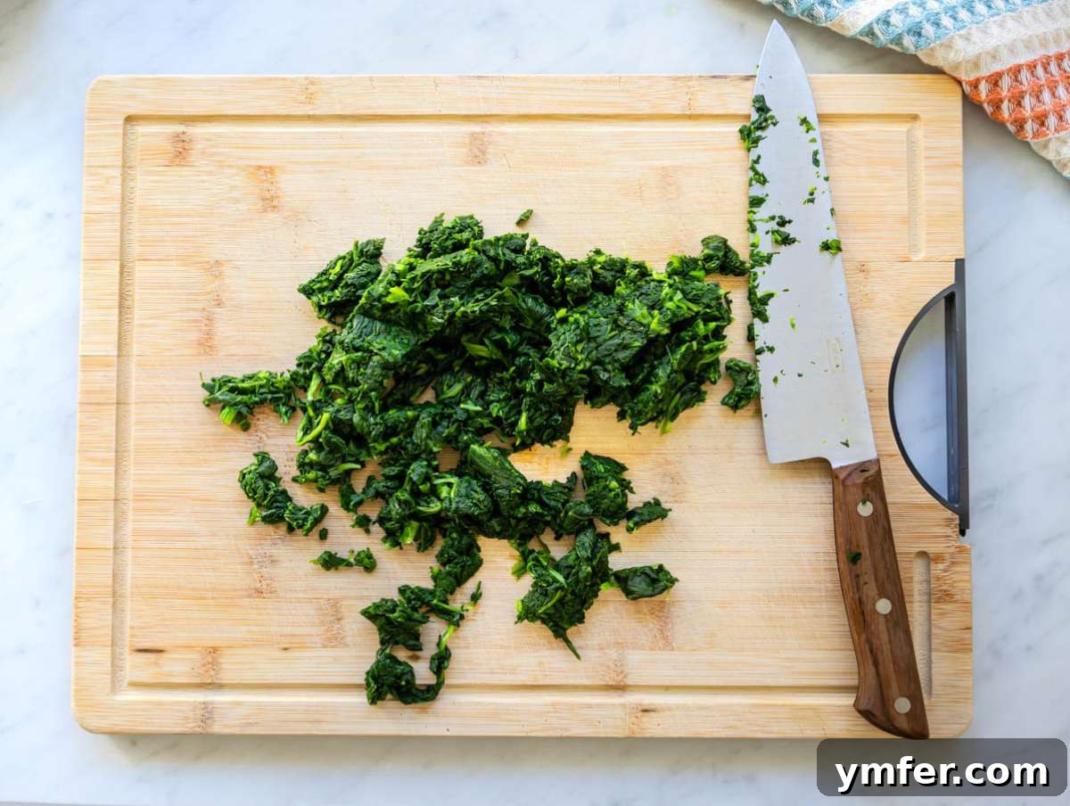 Step one thawed chopped spinach on a cutting board.