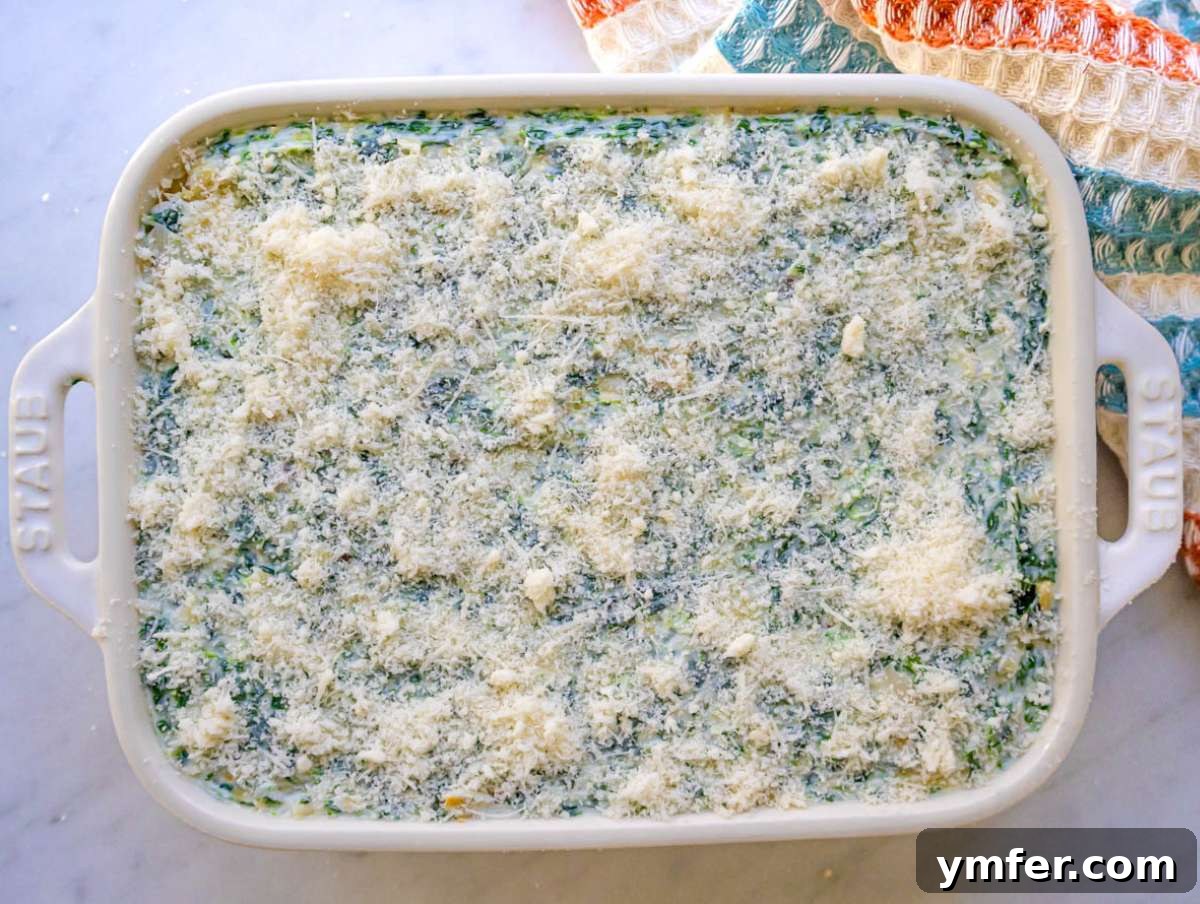 Step three creamy spinach artichoke mixture spread evenly in baking dish.
