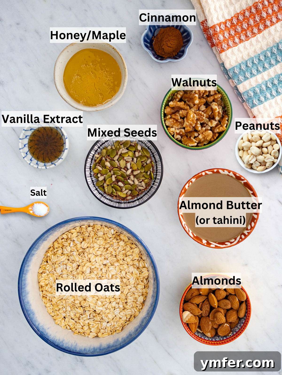 Wholesome & Crispy Granola: Oil-Free Clusters Done Right 3 Rolled oats almond butter nuts and seeds arranged for making crunchy oil free granola.