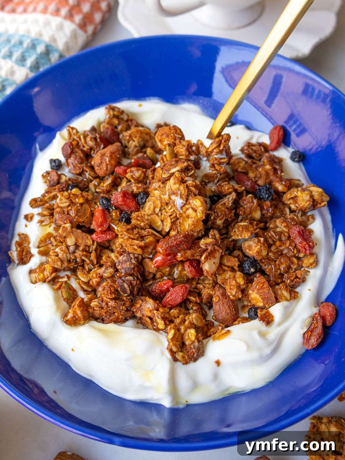 Wholesome & Crispy Granola: Oil-Free Clusters Done Right 4 Homemade healthy granola made without oil served on Greek yogurt for a nutritious breakfast.
