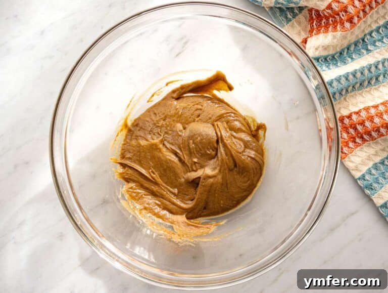 Step 1 Wet ingredients mixed together with almond butter honey vanilla and cinnamon in a large bowl.