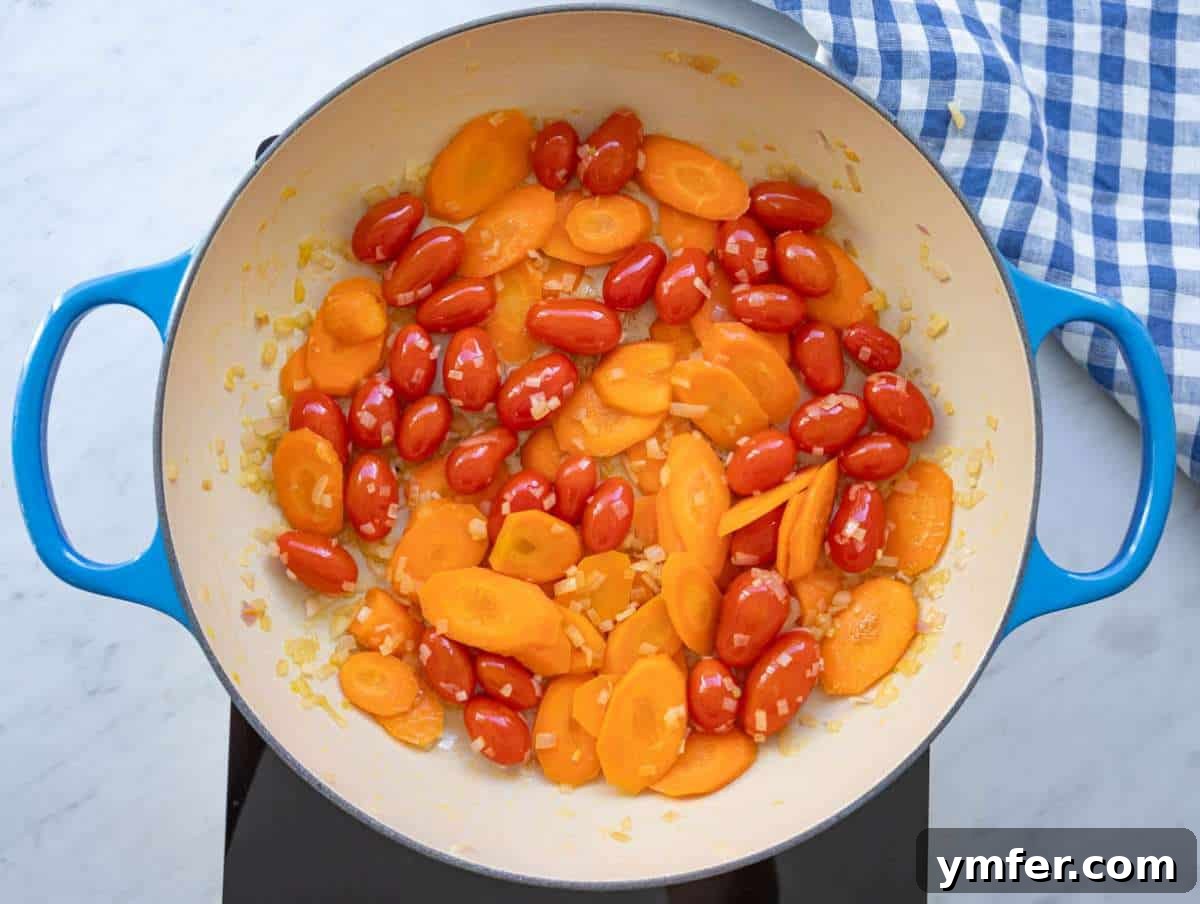 Mediterranean Orzo with Beans A Wholesome One-Pan Meal 5 Step 1 sautéing onion carrot and tomatoes until soft for flavorful base.