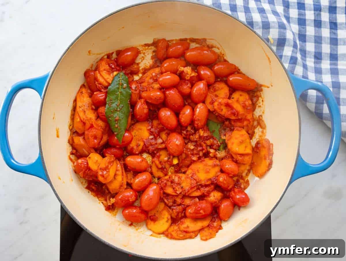 Mediterranean Orzo with Beans A Wholesome One-Pan Meal 6 Step 2 cooking garlic herbs and tomato paste to deepen Mediterranean flavors.