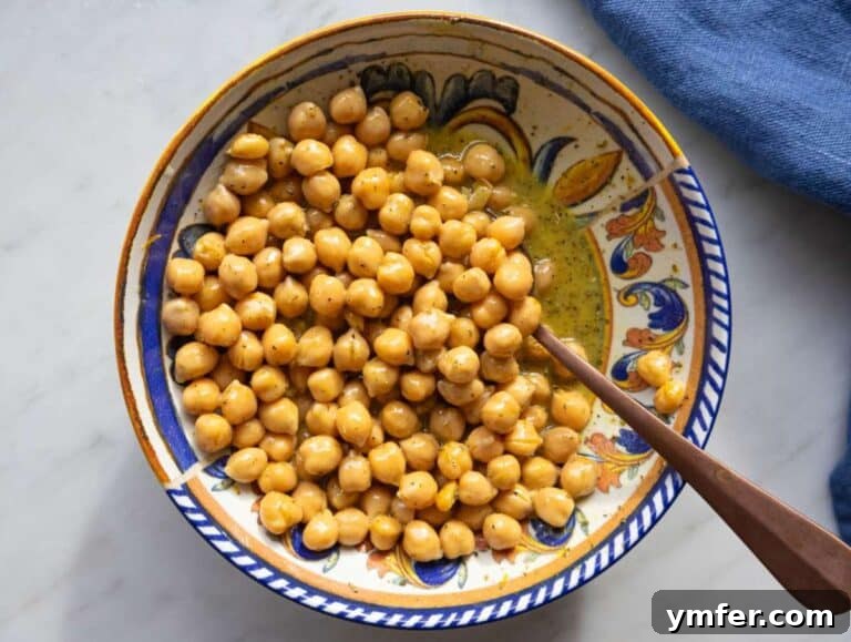 Mediterranean Wild Rice Salad for Healthy Meal Prep 11 Step 2 chickpeas soaking in citrus dressing for extra flavor.
