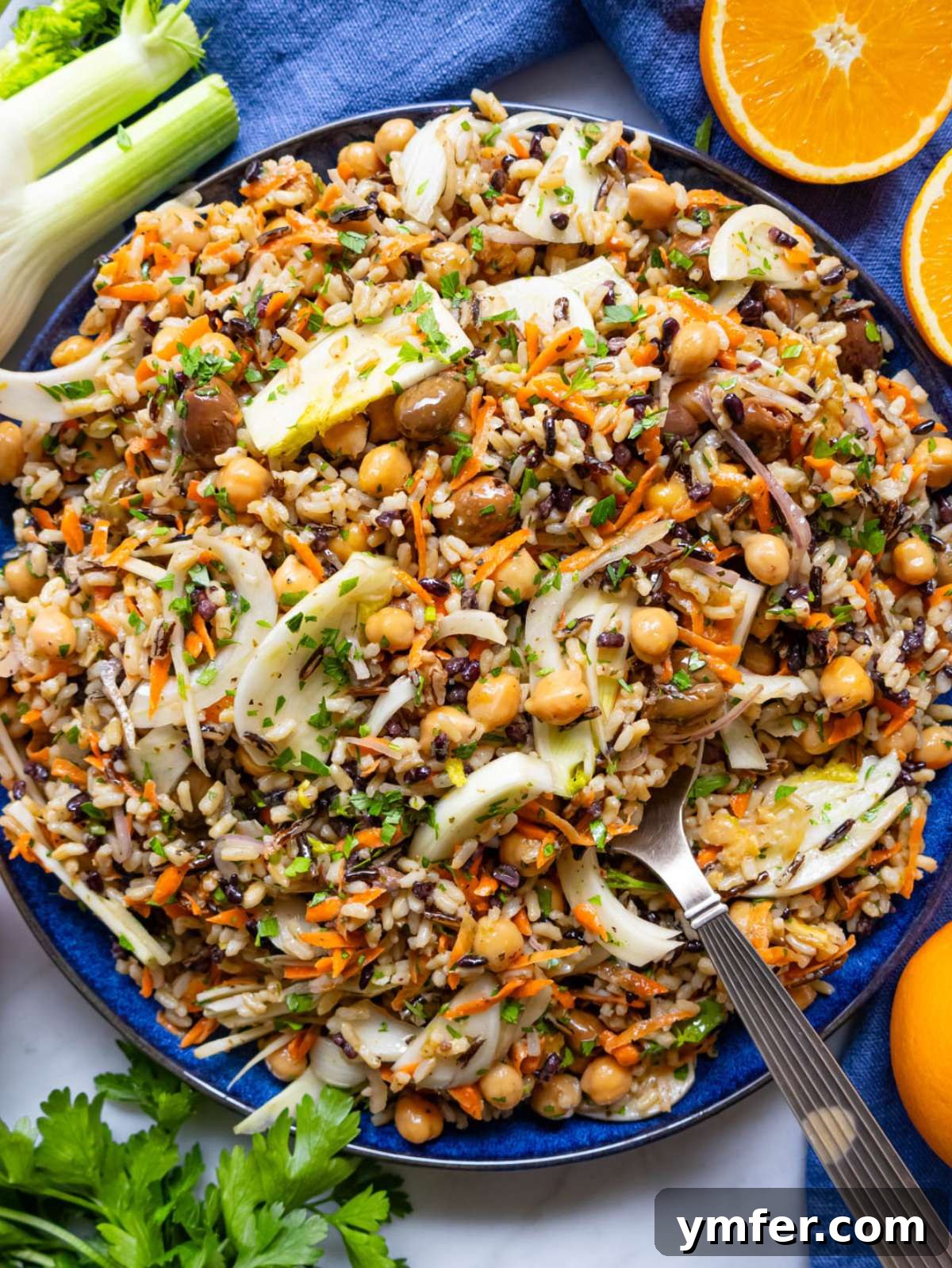 Mediterranean Wild Rice Salad for Healthy Meal Prep 4 Finished salad top down Mediterranean wild rice salad in large bowl with olives.
