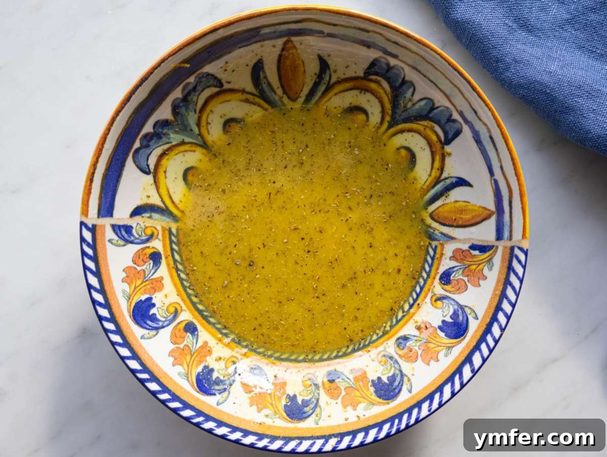 Mediterranean Wild Rice Salad for Healthy Meal Prep 5 Step 1 whisking citrus mustard and olive oil to make bright Mediterranean dressing.
