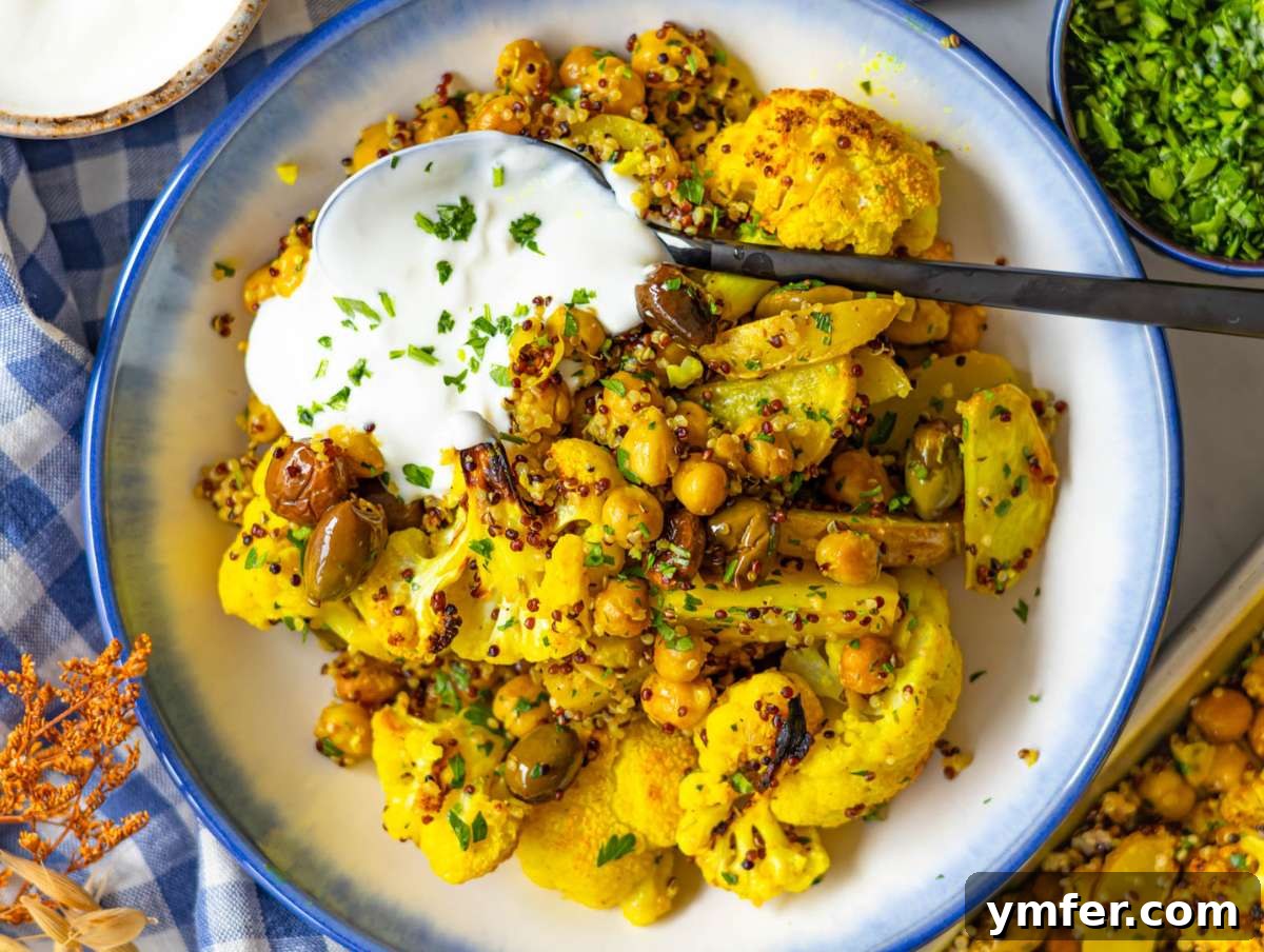 Golden Turmeric Cauliflower and Chickpea Sheet Pan Dinner 8 Step four adding parsley lemon and quinoa to roasted vegetables on baking sheet and serving in a bowl.