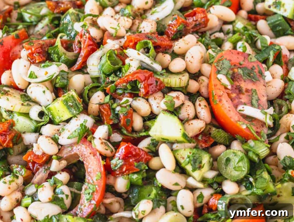 Fuel Up Fast: 25 High-Protein Bean Recipes in 30 Minutes 15 Bright and colorful dense white bean salad served for a Mediterranean inspired meal.