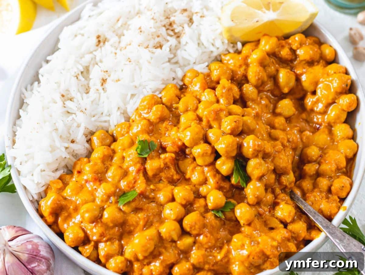 Fuel Up Fast: 25 High-Protein Bean Recipes in 30 Minutes 22 Easy coconut curry recipe with chickpeas creamy high fiber meal in white serving bowl.