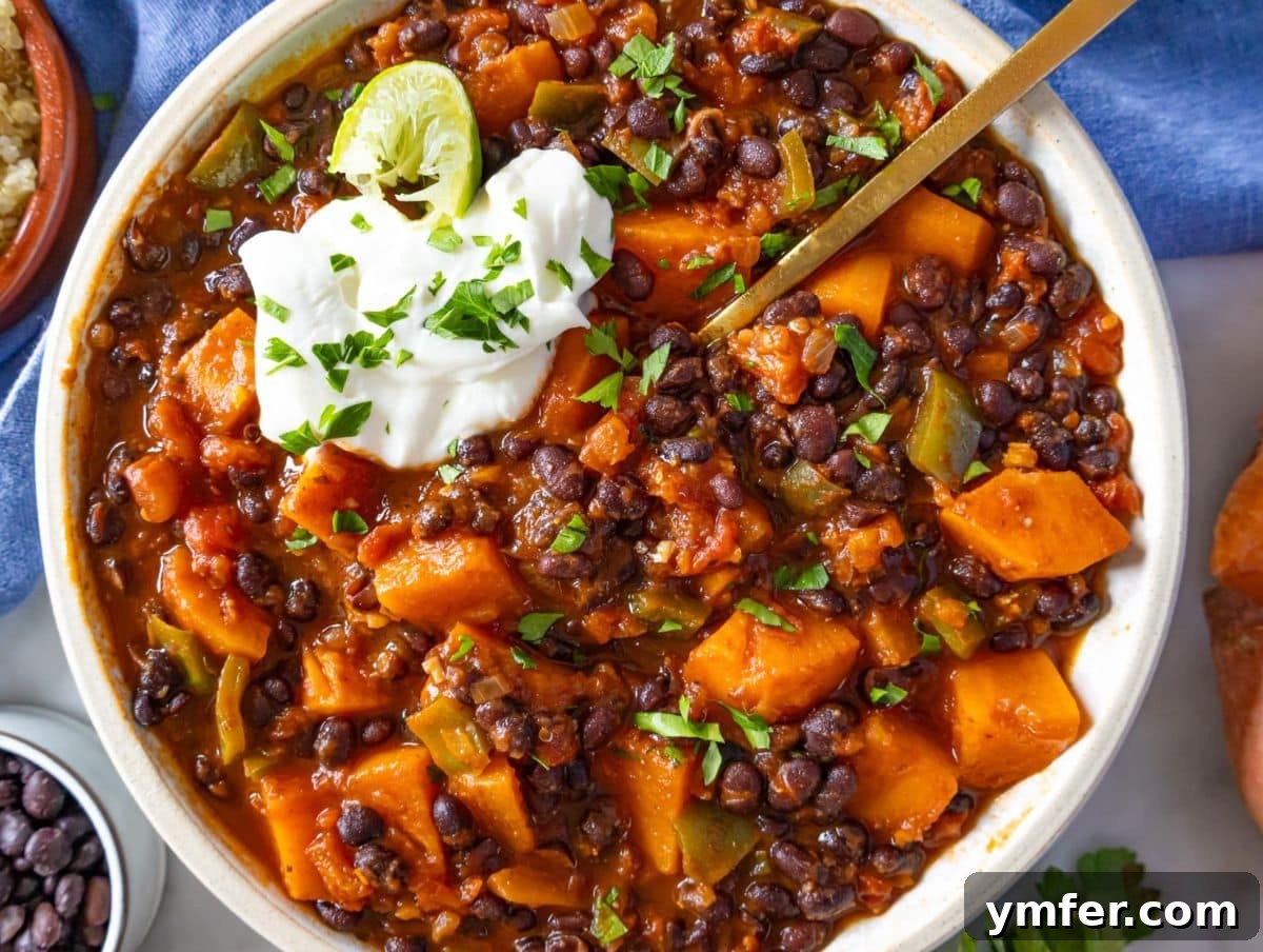 Fuel Up Fast: 25 High-Protein Bean Recipes in 30 Minutes 23 Healthy black bean chili served with Greek yogurt lime and cilantro in a hand made bowl.