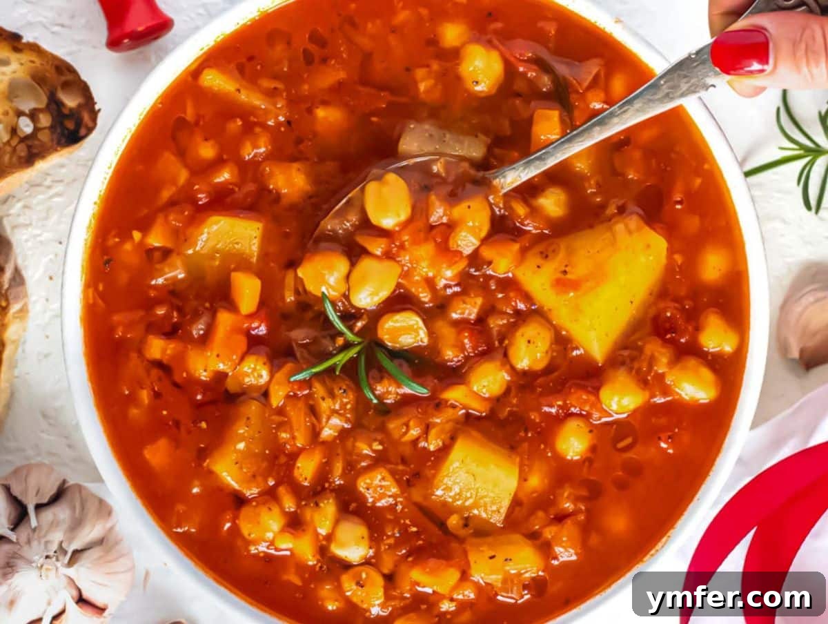 Fuel Up Fast: 25 High-Protein Bean Recipes in 30 Minutes 6 Hearty Mediterranean chickpea soup served hot with bread healthy one pot family recipe.