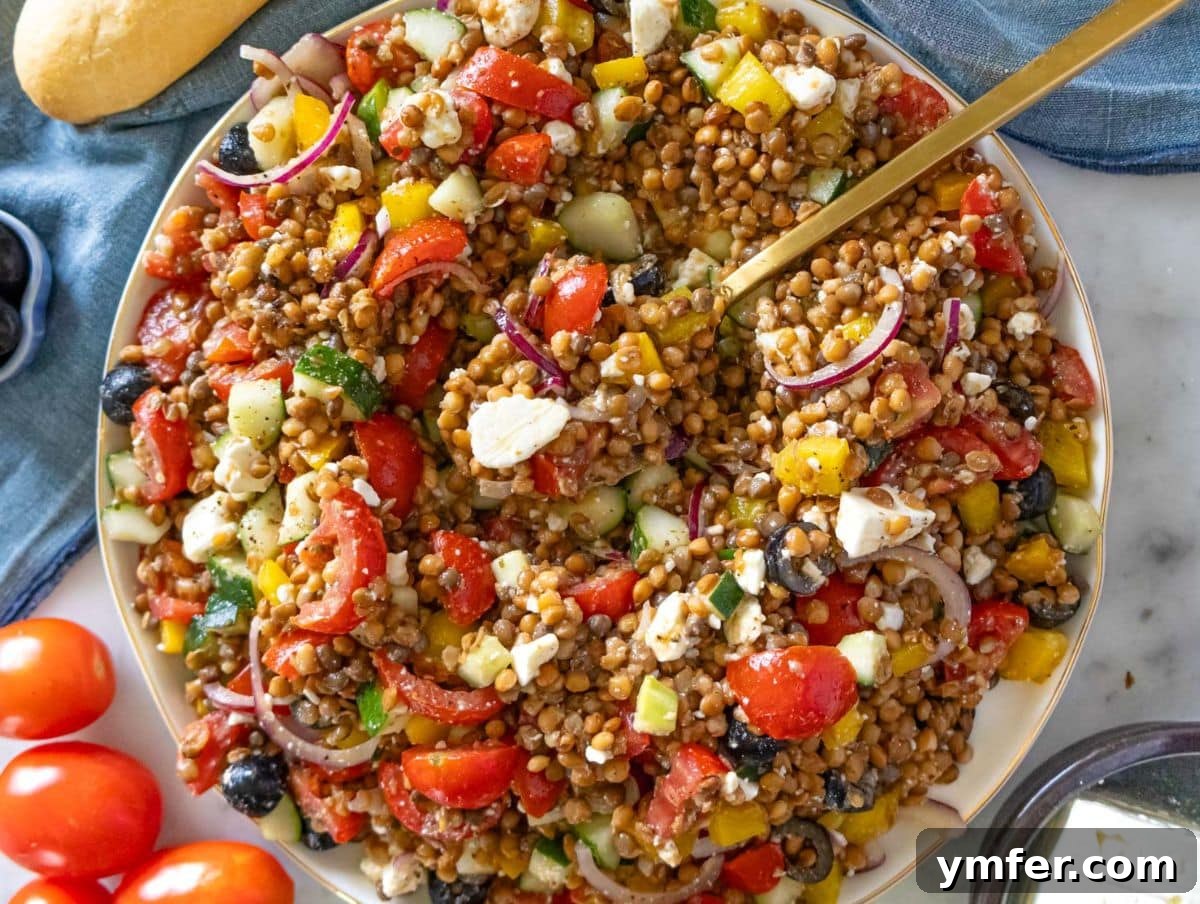 25 Affordable and Healthy Mediterranean Diet Meals 17 Healthy Greek lentil salad ready to serve with fresh vegetables and creamy feta.