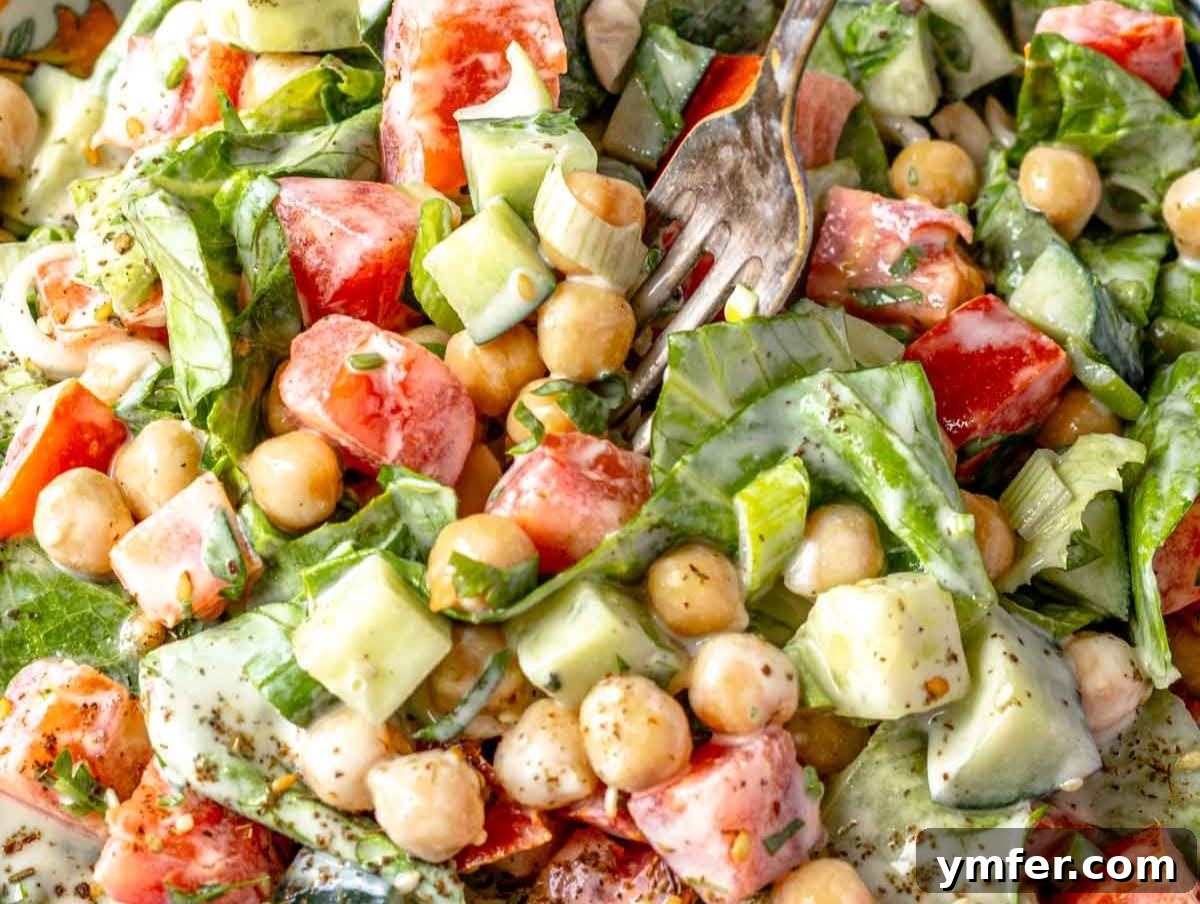 25 Affordable and Healthy Mediterranean Diet Meals 9 Bright chopped chickpea salad with creamy dressing and fresh herbs perfect for an easy healthy lunch.